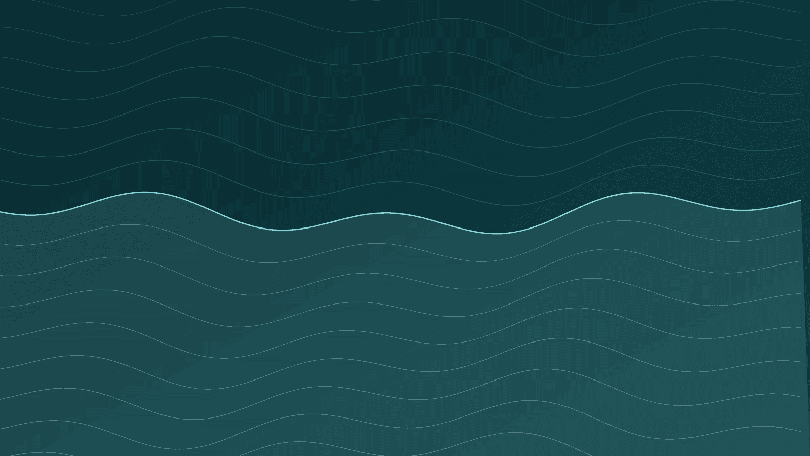 Fully laden ultra-large container vessel navigating coastal container terminal